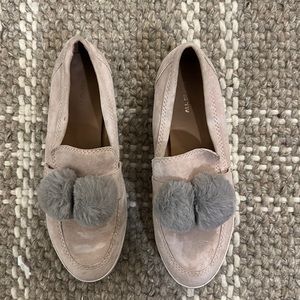 All Black brand velvet shoe with puffs